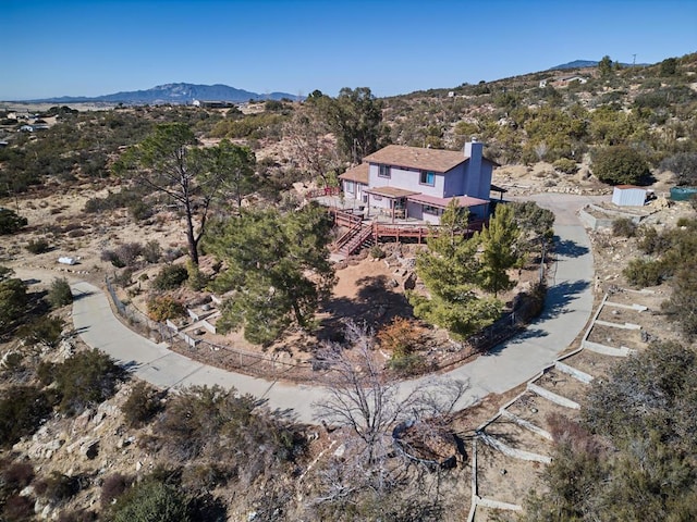 birds eye view of property featuring a mountain view