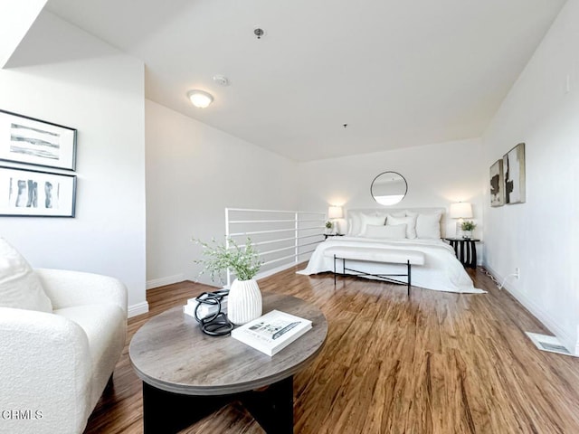 bedroom with hardwood / wood-style floors