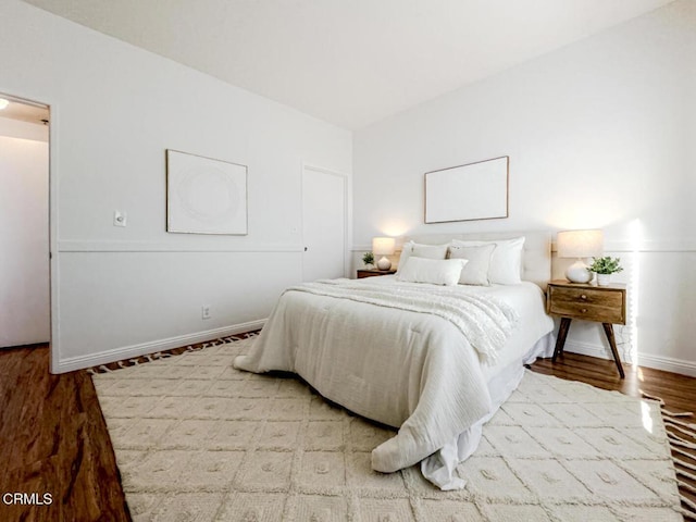 bedroom with hardwood / wood-style flooring