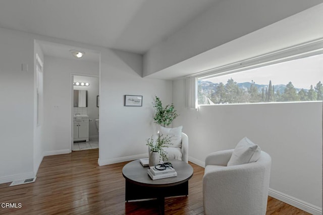 living area featuring hardwood / wood-style floors