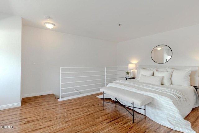 bedroom with light hardwood / wood-style floors