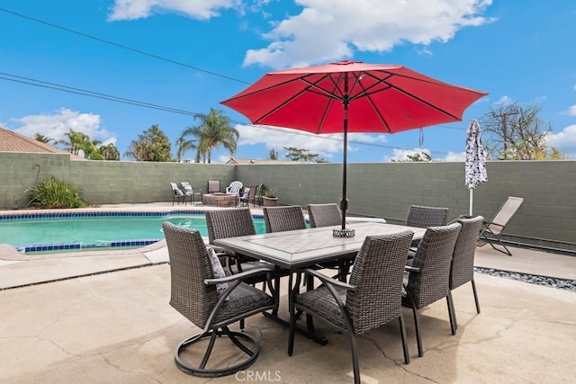 view of patio / terrace with a fenced in pool