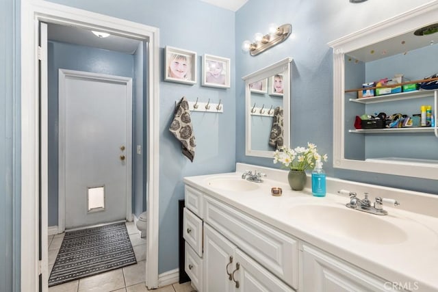 bathroom with vanity, tile patterned floors, and toilet