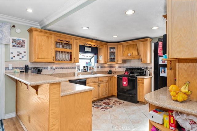 kitchen featuring premium range hood, ornamental molding, kitchen peninsula, and black appliances