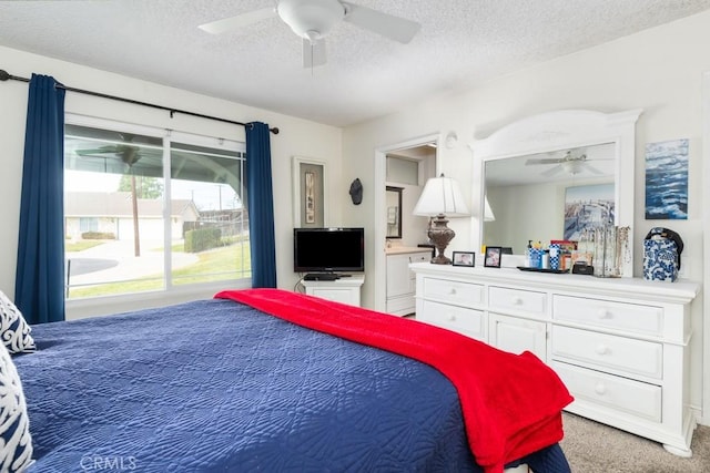 bedroom with carpet flooring, a textured ceiling, and ceiling fan