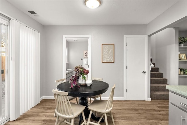 dining room with light wood-type flooring