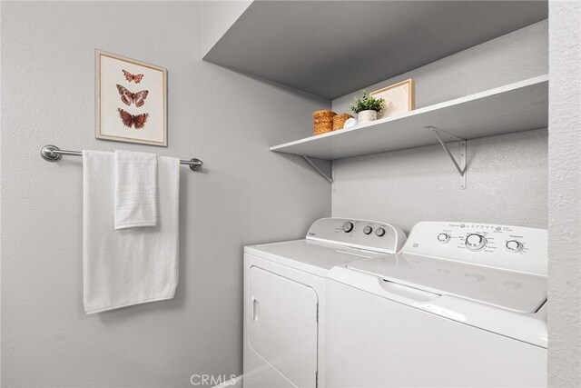 laundry area with independent washer and dryer