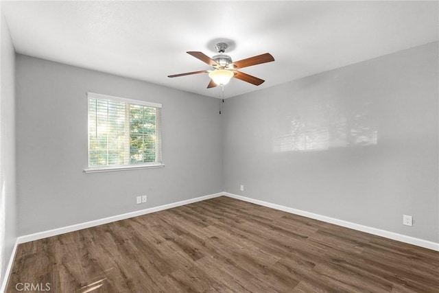 unfurnished room featuring ceiling fan and dark hardwood / wood-style floors