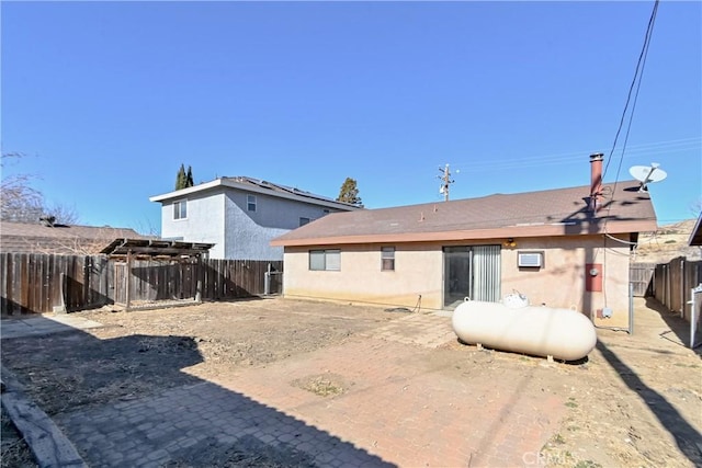 rear view of house with a patio and a pergola