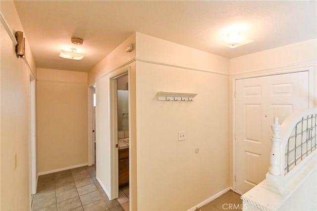 hallway featuring tile patterned flooring