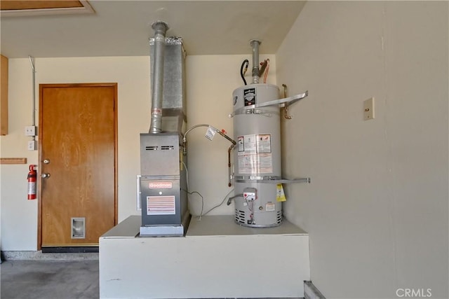 utility room with strapped water heater