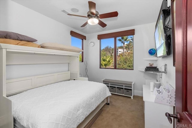 carpeted bedroom featuring ceiling fan