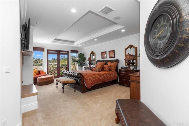 bedroom with light carpet, ornamental molding, a raised ceiling, and french doors