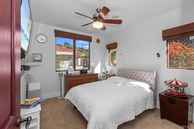 bedroom with light colored carpet and ceiling fan