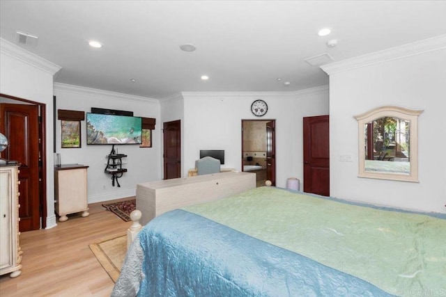 bedroom with crown molding and light hardwood / wood-style floors