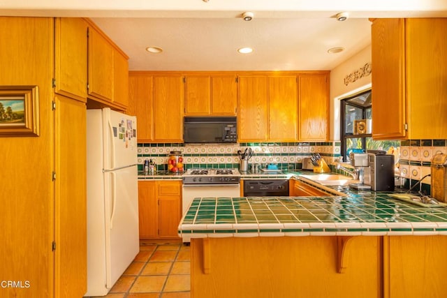 kitchen featuring black appliances, light tile patterned flooring, decorative backsplash, tile countertops, and kitchen peninsula