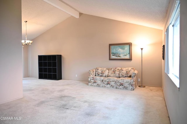 unfurnished room featuring carpet flooring, lofted ceiling with beams, and a notable chandelier