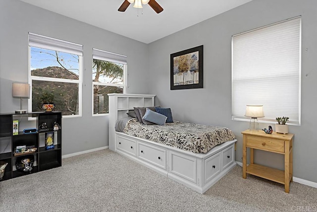 bedroom with ceiling fan and light colored carpet