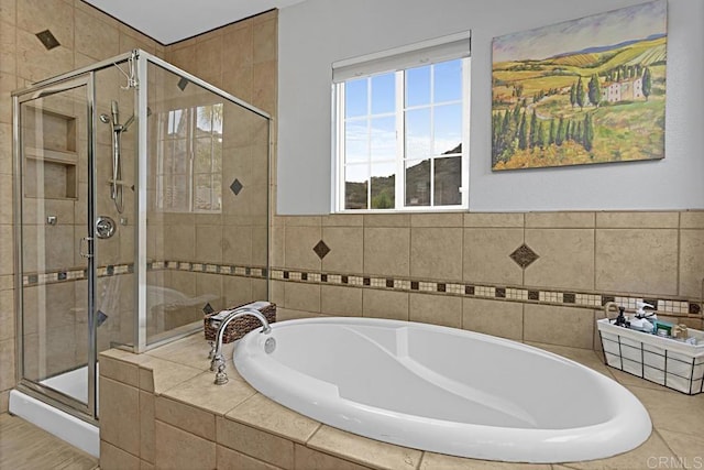 bathroom with shower with separate bathtub