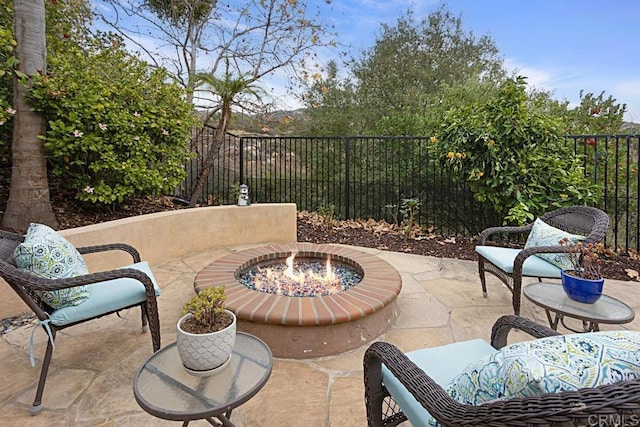 view of patio with a fire pit