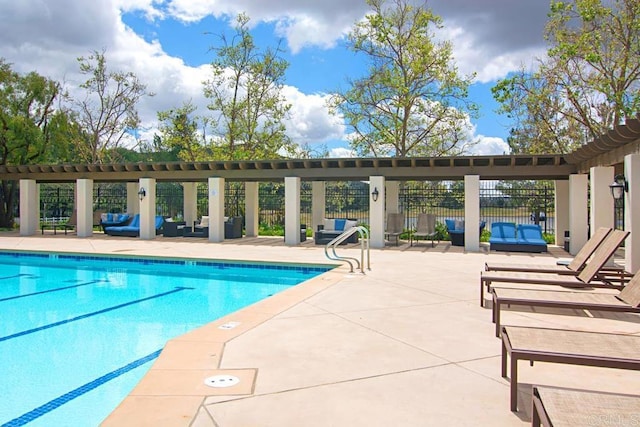 view of pool featuring outdoor lounge area and a patio area