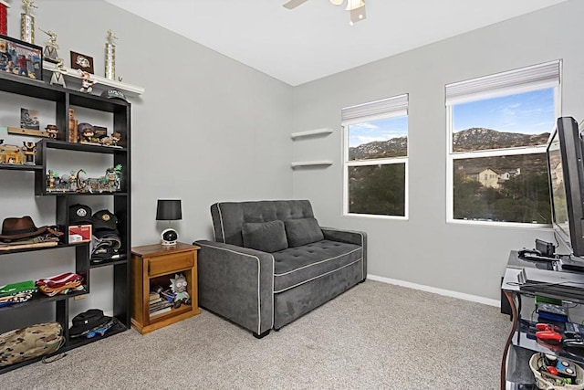 sitting room with light carpet and ceiling fan