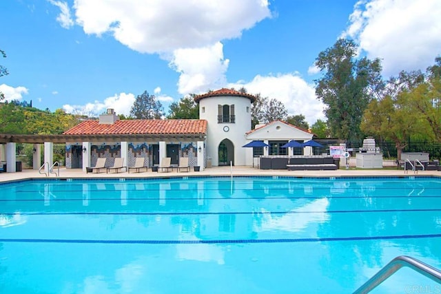 view of swimming pool featuring outdoor lounge area and a patio area