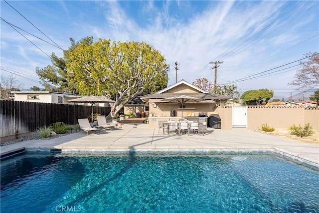 view of swimming pool with a patio area