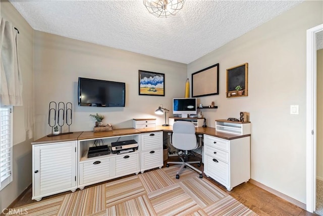 office area featuring a textured ceiling