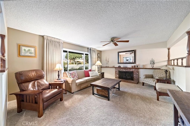 living room with a fireplace, light colored carpet, a textured ceiling, and ceiling fan