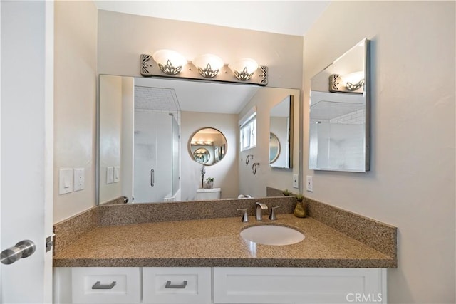 bathroom featuring toilet and vanity