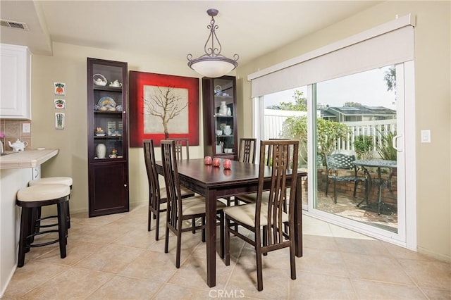 dining space with light tile patterned floors