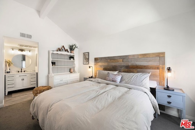 bedroom featuring sink, carpet, high vaulted ceiling, ensuite bath, and beamed ceiling