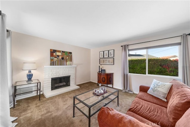 carpeted living room with a stone fireplace