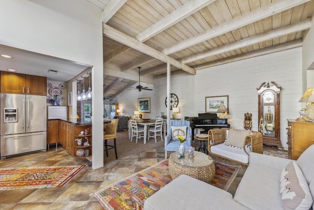 living room featuring ceiling fan, brick wall, wooden ceiling, and lofted ceiling with beams