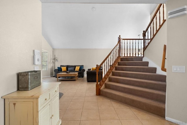 stairway with vaulted ceiling, an AC wall unit, and tile patterned flooring