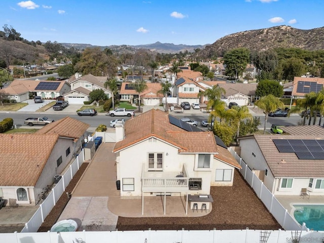 birds eye view of property with a mountain view