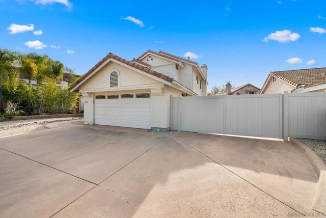 view of property exterior with a garage