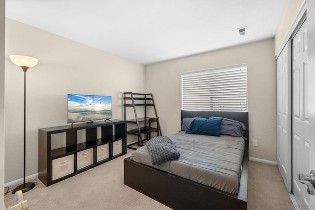 carpeted bedroom with a closet