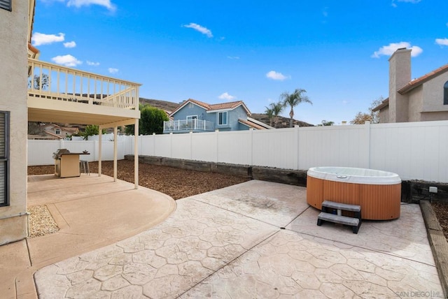 view of patio / terrace featuring a hot tub