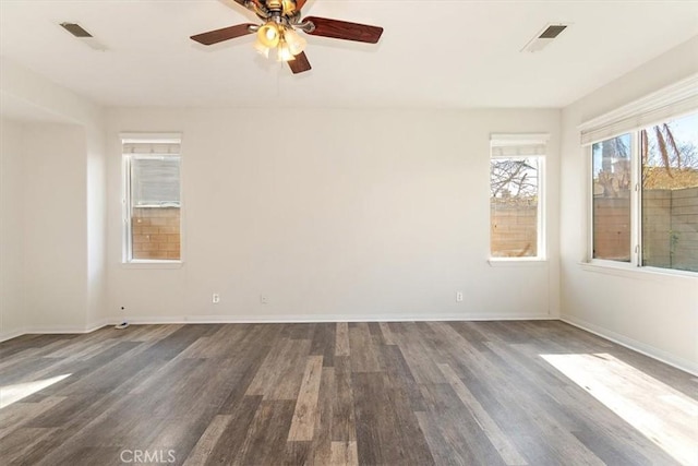 unfurnished room featuring dark hardwood / wood-style floors and ceiling fan