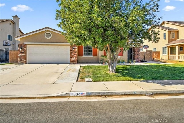 view of front of house featuring a garage and a front lawn