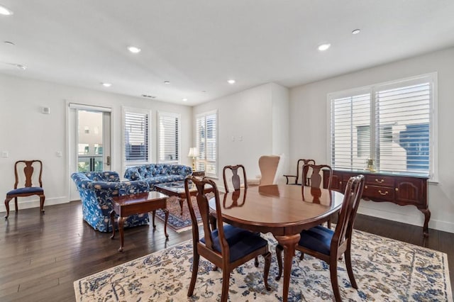 dining room with dark wood-type flooring