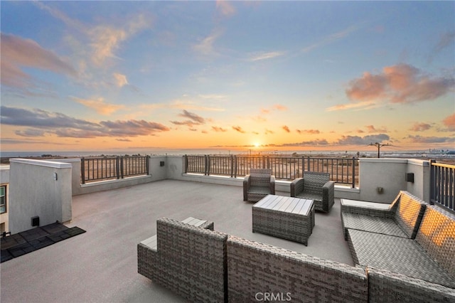 patio terrace at dusk with outdoor lounge area