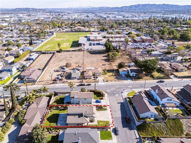 birds eye view of property with a mountain view