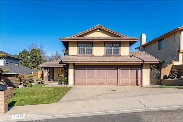 view of front property with a garage and a front lawn