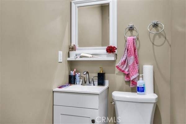 bathroom with toilet and vanity