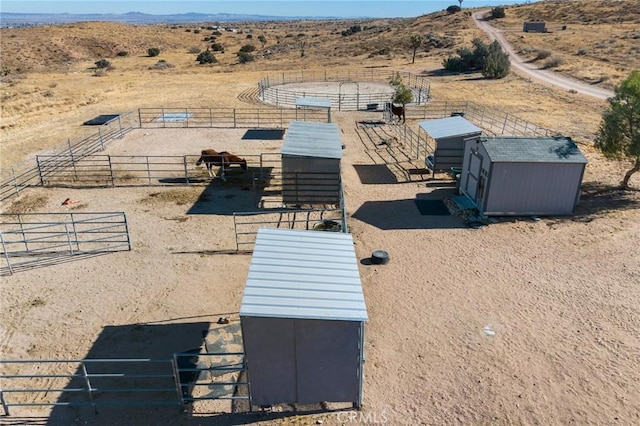 birds eye view of property featuring a rural view