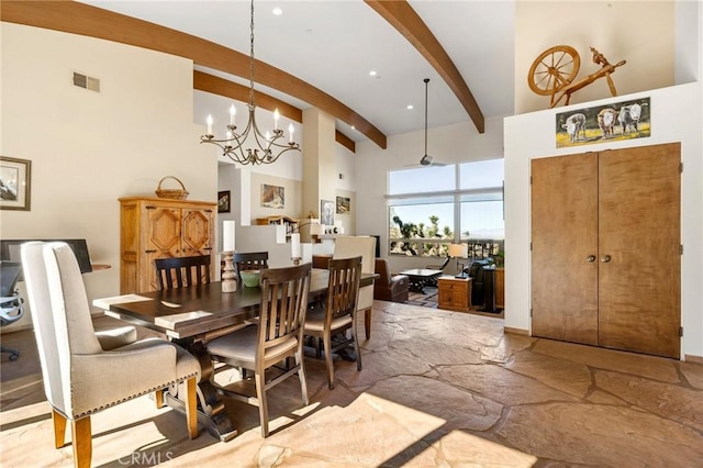 dining room with a notable chandelier and beamed ceiling