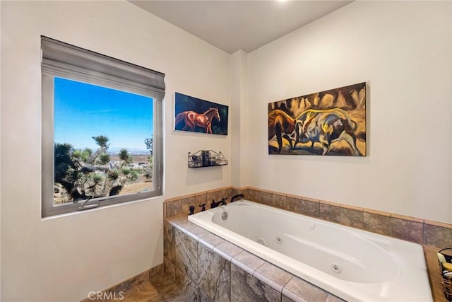 bathroom with tiled bath